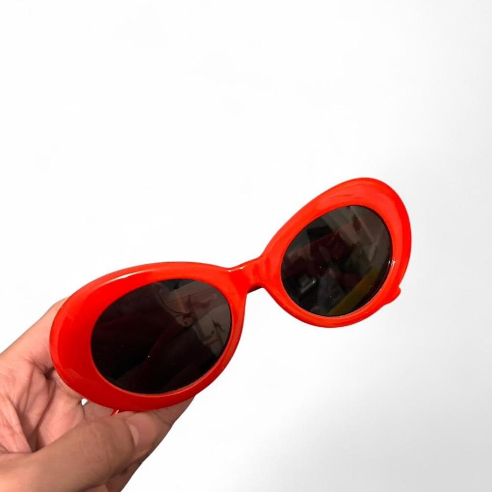 Red sunglasses with black lenses